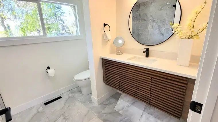 Renovated bathroom with a tiled walk-in shower