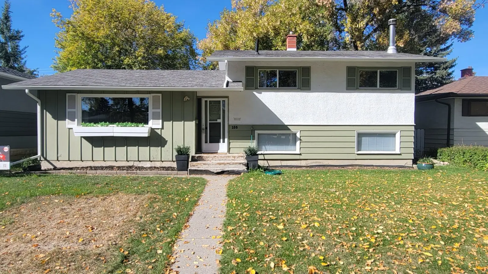House exterior before renovation, with older siding