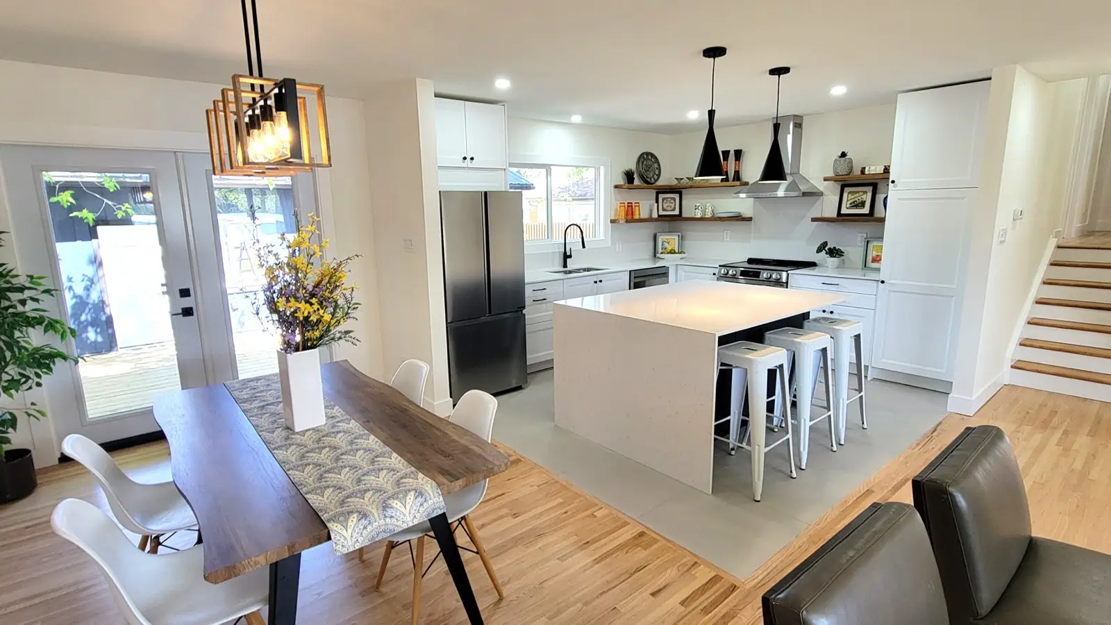 The same kitchen after renovation, opened up with new cabinetry