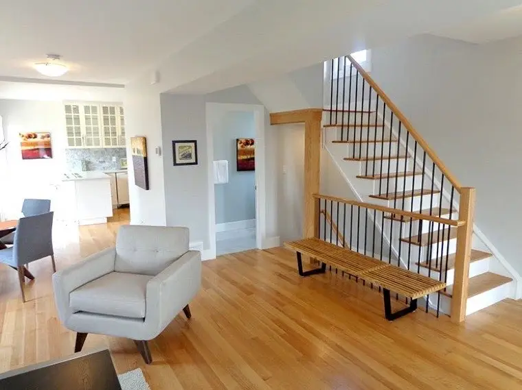 Finished basement stairwell with new railing and lighting